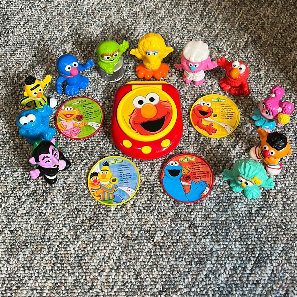 Sesame Street mini CD player with figurines and CDs